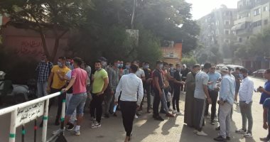 Voters begin to gather outside polling places before voting starts