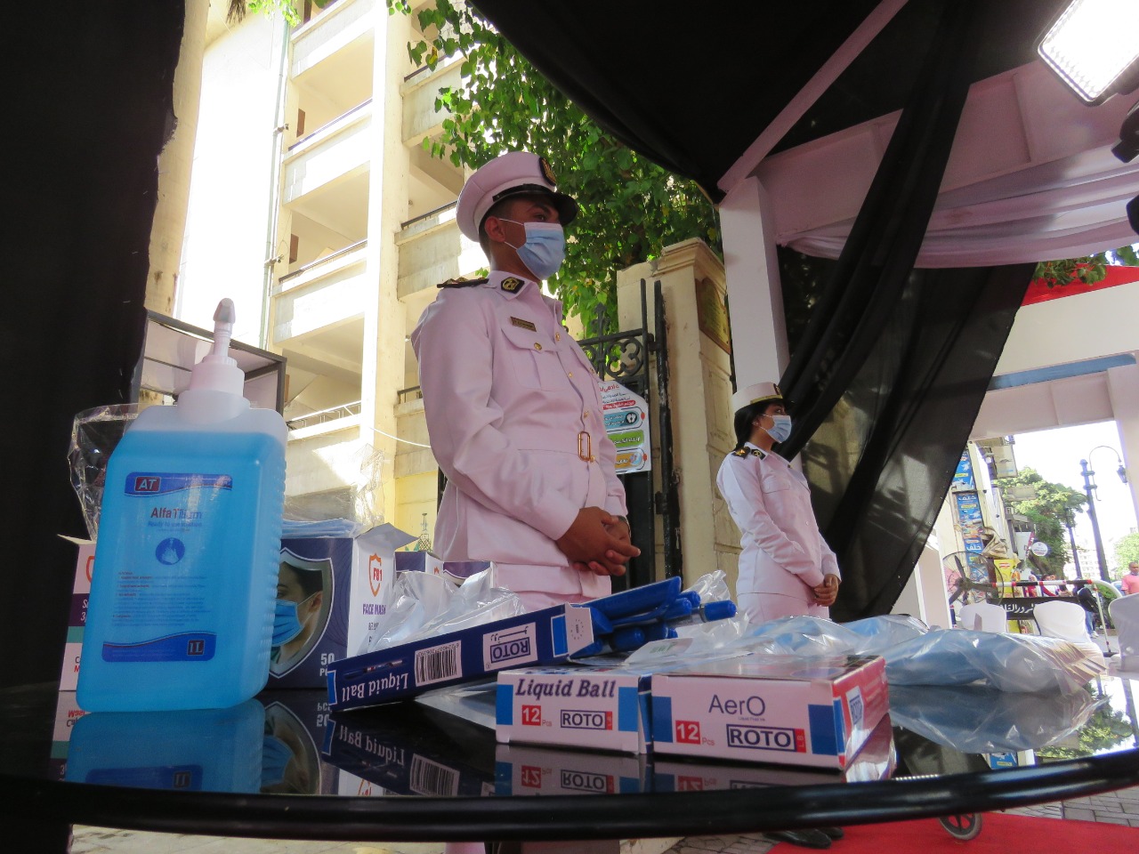 Security personnel oustide polling stations along with masks and disinfectants 