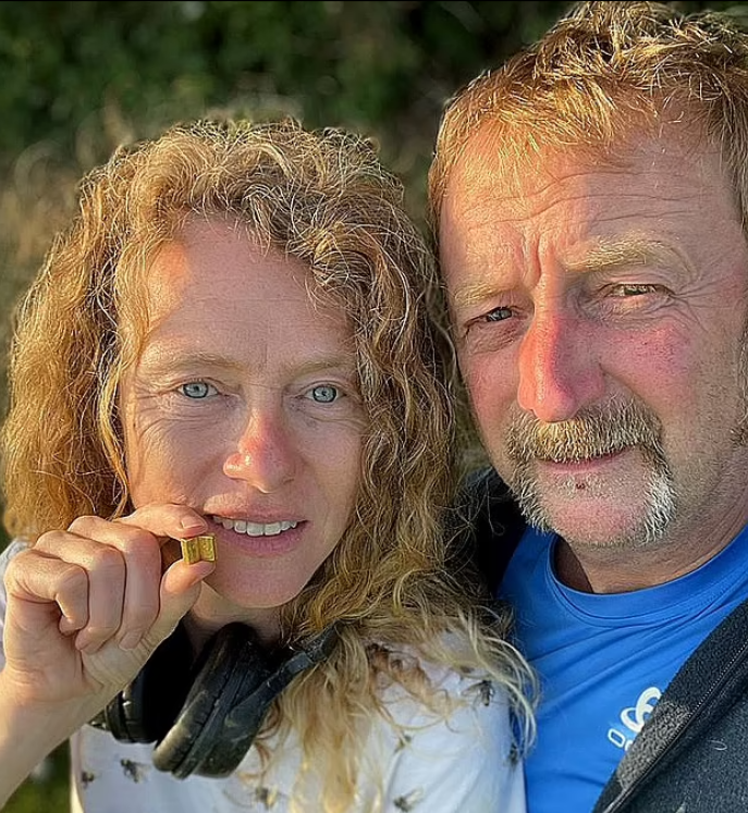 The couple holding the gold Bible - Daily Mail