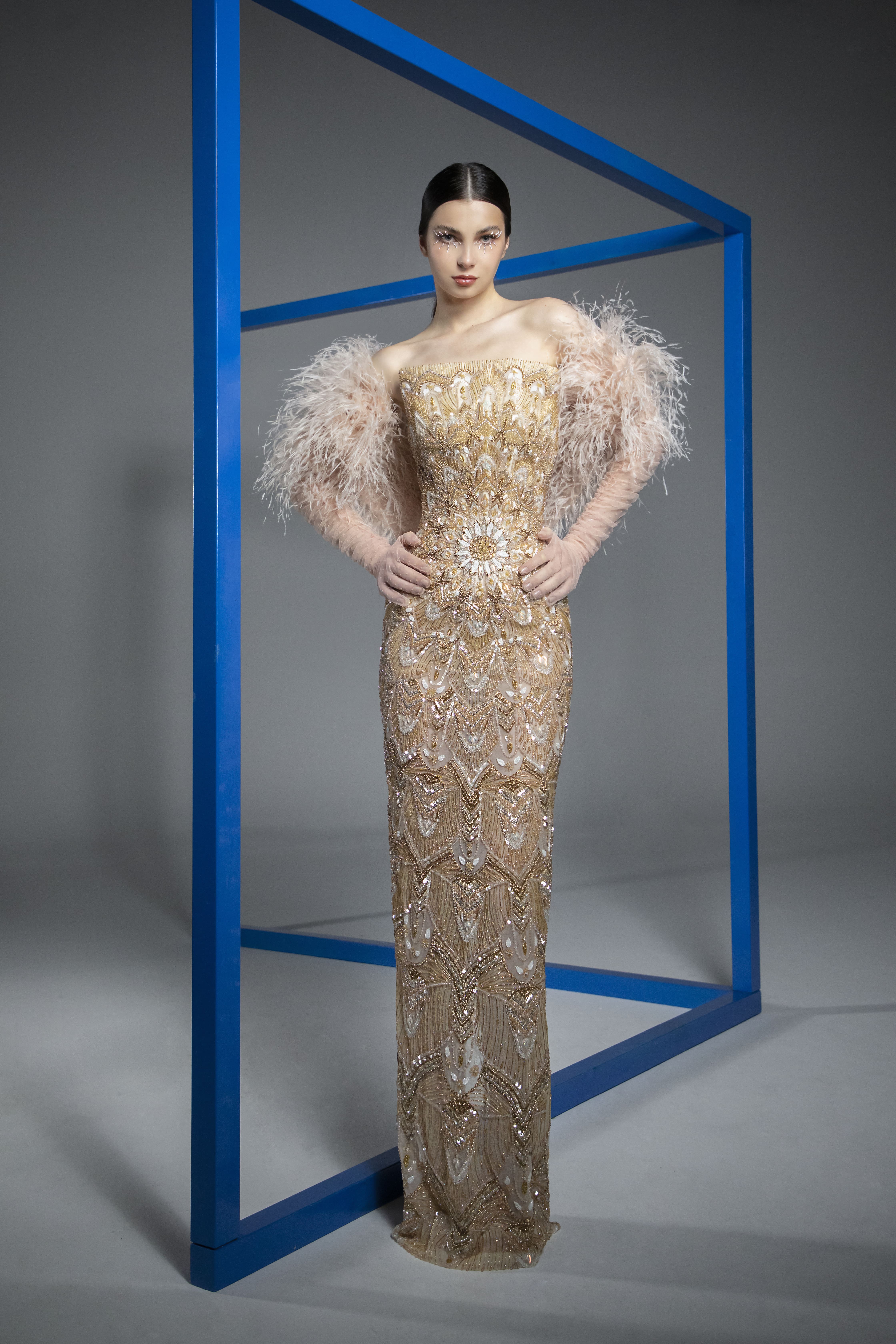 SS21-5 Gold mandala inspired gown embroidered with crystals, beads and sequins featuring tulle polka dot sleeves with laser-cut feathers -min