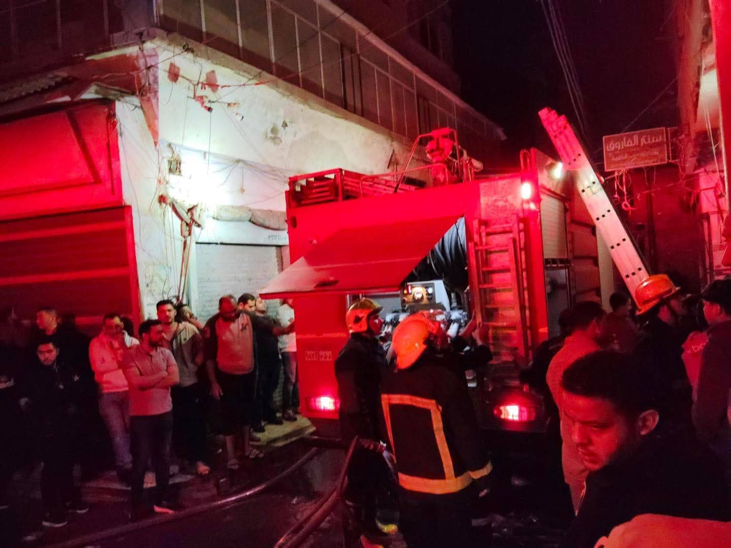 Civil defense personnel combating fire