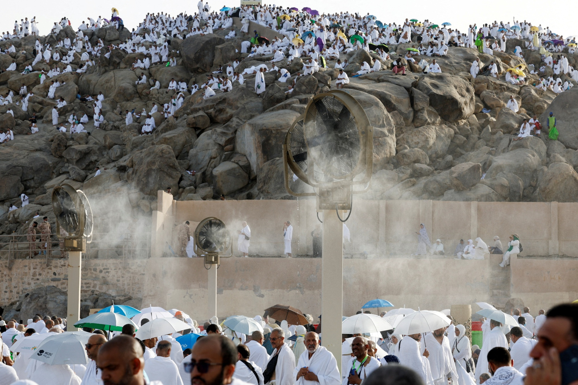 Pilgrims moving between holy sites during Hajj