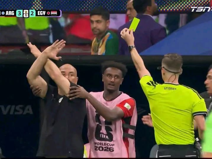 Hossam Hassan shown a yellow card